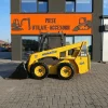 Miniîncărcător Komatsu SK815 – 3000 kg -Cupa multifunctionala
